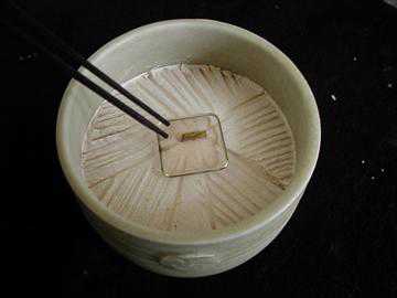 Placing the Incense Wood Placing the Incense Wood