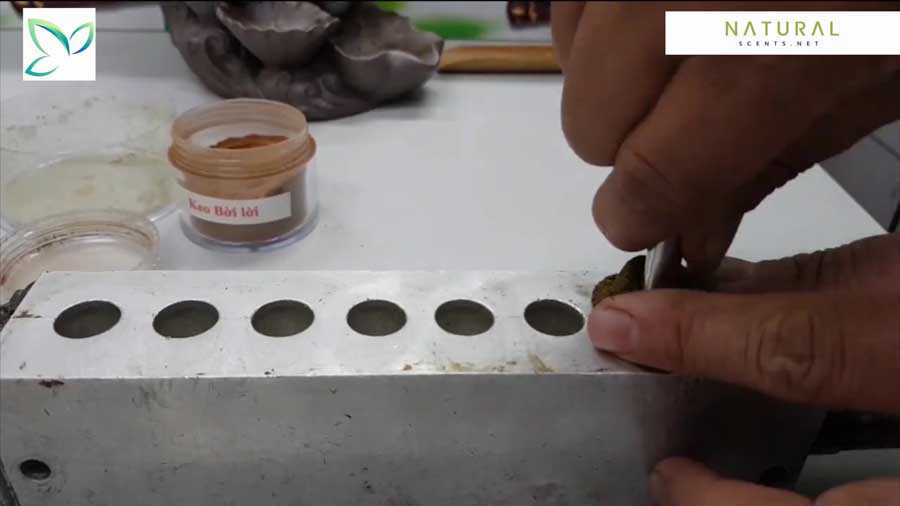 Put the ingredients into the mold Put the ingredients into the mold to create the incense cone.