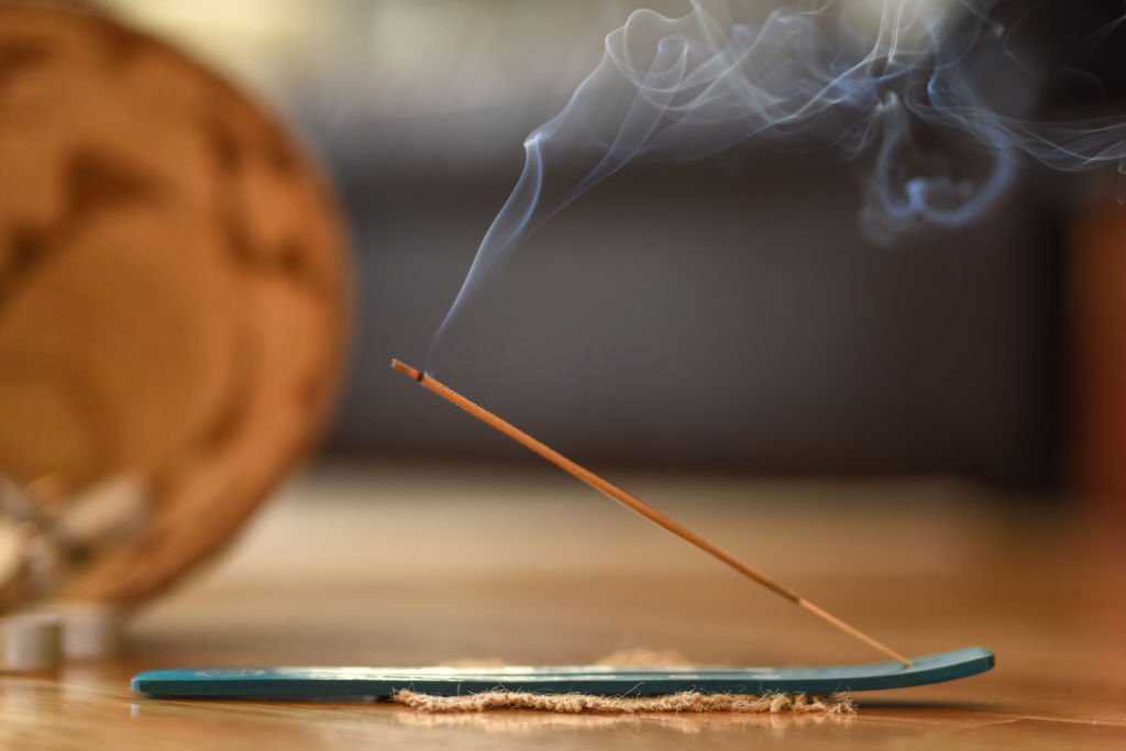 incense sticks burning There are many different types of incense and each type will have a specific aroma.