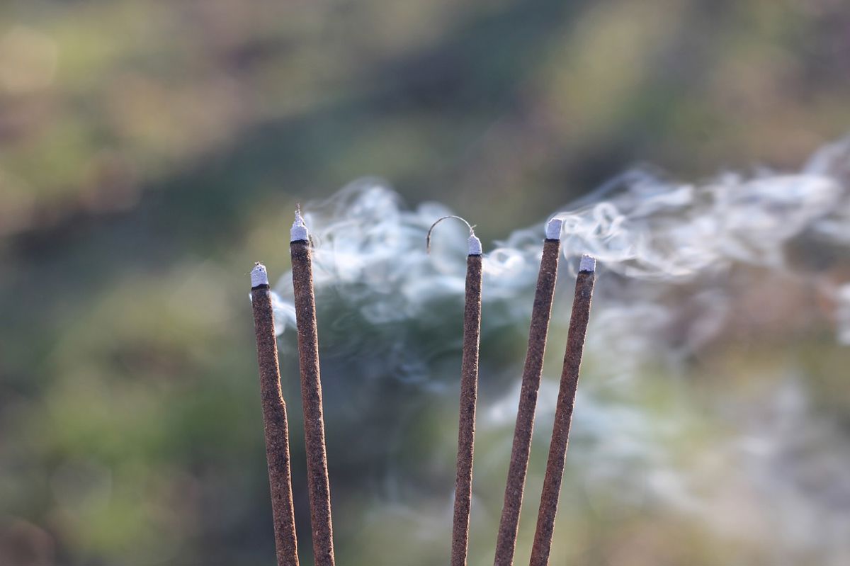 five incense sticks To honor the Five Elements, the people are lighting these five incense sticks.