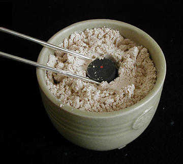 Placing Charcoal in Kiki-gouro Placing Charcoal in Kiki-gouro