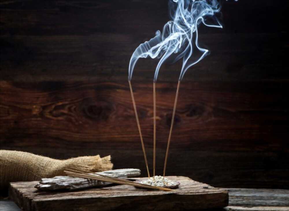 Three incense sticks are burning Three incense sticks are burning.
